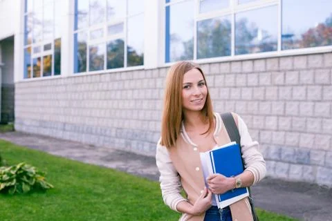 Student standing on building background Stock Photos
