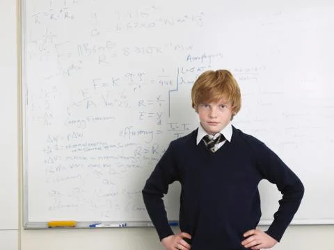 Student Standing By Whiteboard In Math Class Stock Photos