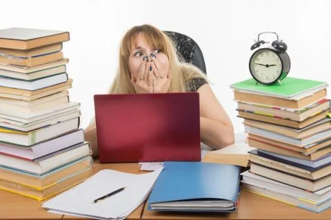 The student stayed on night at the computer and was horrified to look at the  Stock Photos