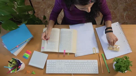 Student studying book eating snack, girl education college university Stock Footage 65200449