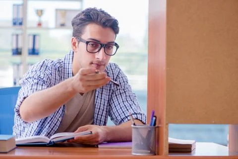 Student studying at home preparing for exam Stock Photos