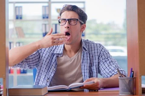 Student studying at home preparing for exam Stock Photos