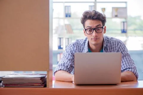 Student studying at home preparing for exam Stock Photos
