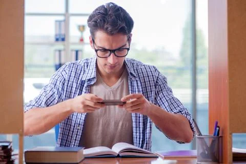 Student studying at home preparing for exam Stock Photos