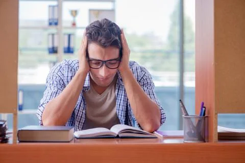 Student studying at home preparing for exam Stock Photos