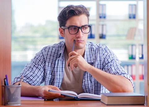 Student studying at home preparing for exam Stock Photos