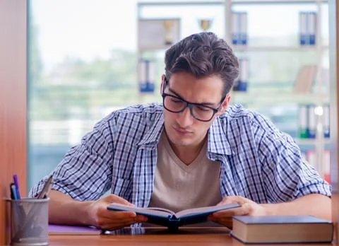 Student studying at home preparing for exam Stock Photos