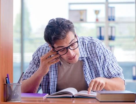 Student studying at home preparing for exam Stock Photos