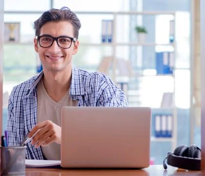 Student studying at home preparing for exam Stock Photos