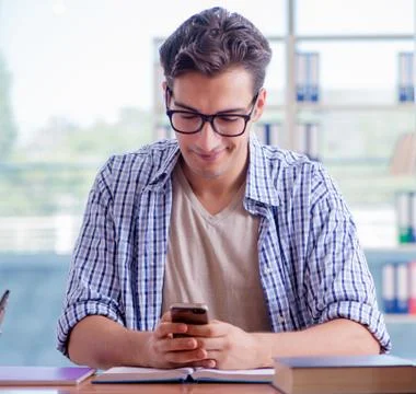 Student studying at home preparing for exam Stock Photos