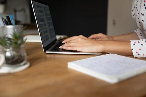 Student studying from home, using laptop, doing homework Stock Photos