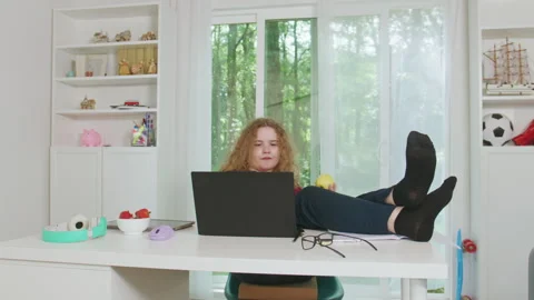 Student studying with laptop computer. Online learning during school lesson 库存影片 338370213