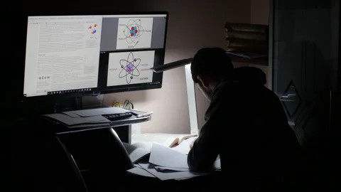 Student Studying Late At Night For Exams Stockbeeldmateriaal 86773219