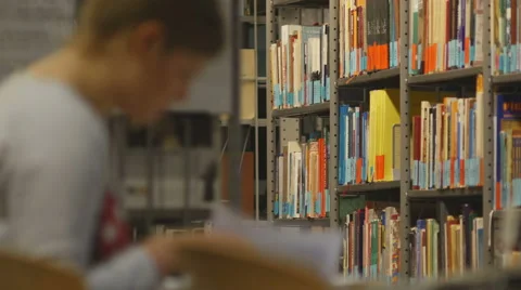 Student studying in library 4K Stock Footage