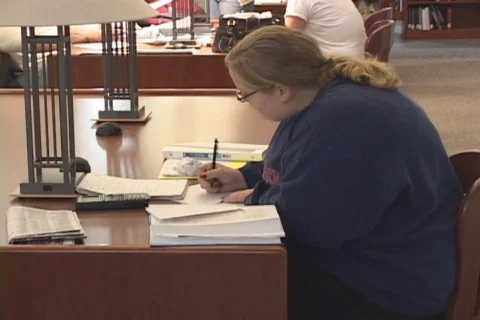 Student studying in library Stock Footage 548970