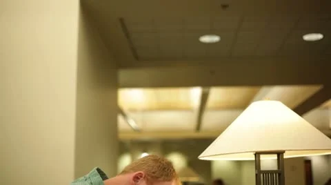 Student studying in library. Video stock 8853562