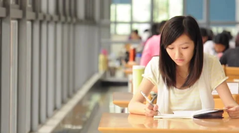 Student studying in library Stock Footage 46970814