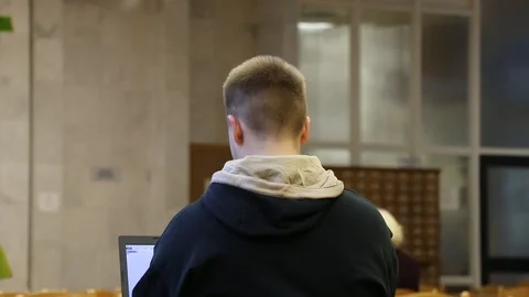 Student studying in the library Video stock 104521526