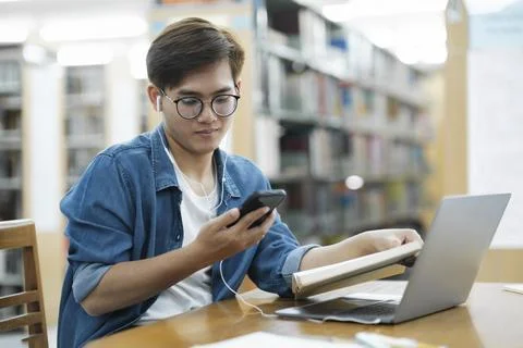 Student studying at library. Stock Photos