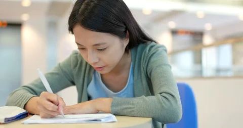 Student studying on note at school Stock Footage 91747764