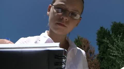 Student studying outdoors Stock Footage 22637789