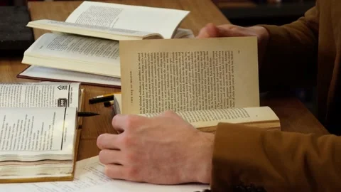Student at the table with books Stock Footage 155963024
