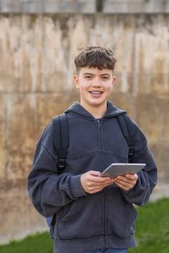 Student with tablet smiling on campus for education Stock Photos