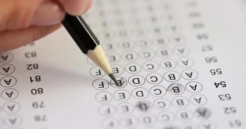Student takes test highlighting answer with pencil Stock Footage 264117845