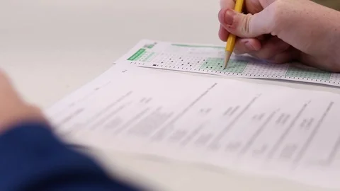The student takes a test on a scantron, dolly pull out Stock Footage 118354989