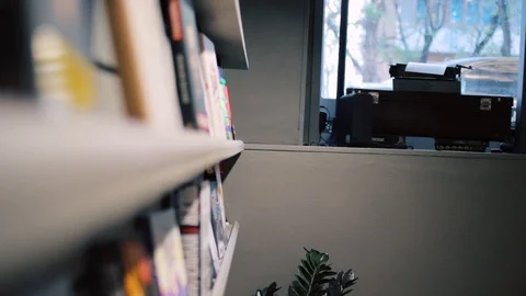 Student taking books and reading them in book shop Stock Footage 118214688