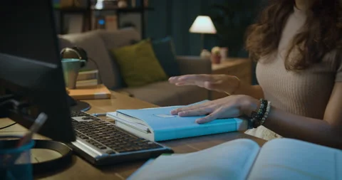 Student taking a break after studying late at night Stock Footage 162994932