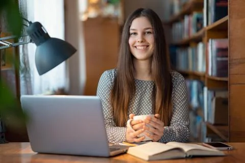 Student taking a break from long and hard studying for a cup of hot tea Stock Photos