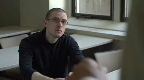 Student talking with professor in classroom Stock Footage 11129540