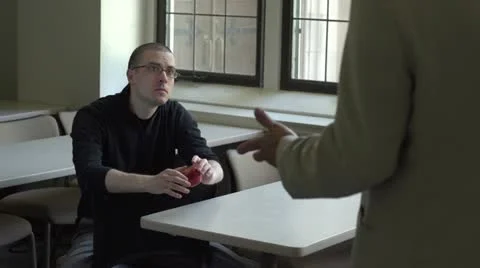 Student talking with professor in classroom Stock Footage