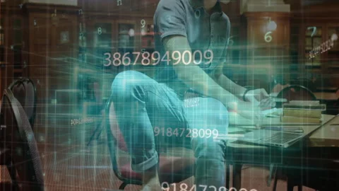 Student tapping laptop, causing code streams to flow in library while studying Video stock 312298062