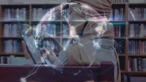Student tapping tablet in library initiating nodes forming globe above open palm Stock Footage 313149617