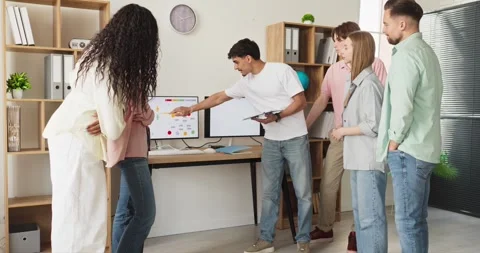 Student team discussing data in office presentation, planning project together Stock Footage 338436423