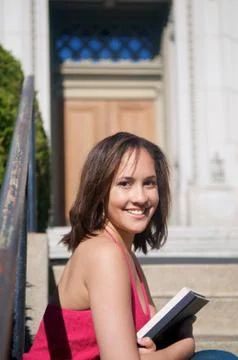Student with textbook on campus Stock Photos