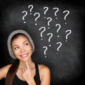 Student thinking with question marks on blackboard Stock Photos