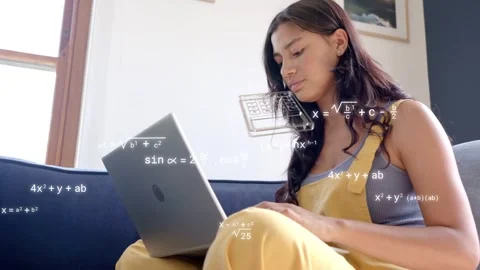 Student typing on laptop, causing math formulas and wireframes sweeping across Stock Footage 333594570