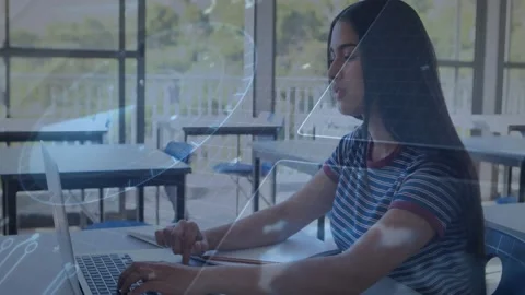 Student typing on laptop by window, tapping pad and causing HUD overlay shifting Stock Footage 331227221