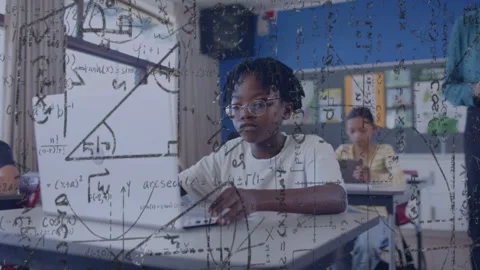 Student typing as teacher coming helping with math formulas overlaying growing Stock Footage 334351973