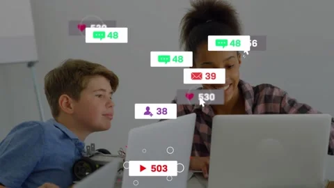 Student typing in tech lab, starting social icons growing over laptops, robot, Stock Footage 332404862