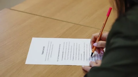 Student underlining random words on a case study at school. Video stock 308218986