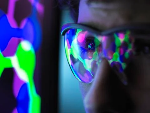 Student understanding the design of a molecular structure on computer screen in Stock Photos
