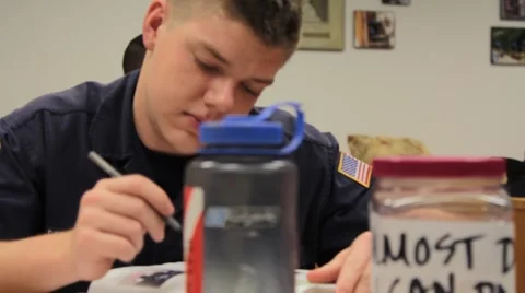 Student in Uniform at Desk Stock Footage 40700737