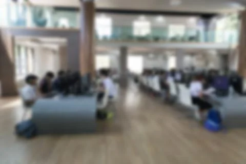 Student use computer to access to internet for education in university (blurr Stock Photos