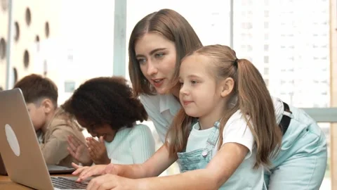 Student use laptop writing code while teacher explain about program. Erudition. Stock Footage 273844865