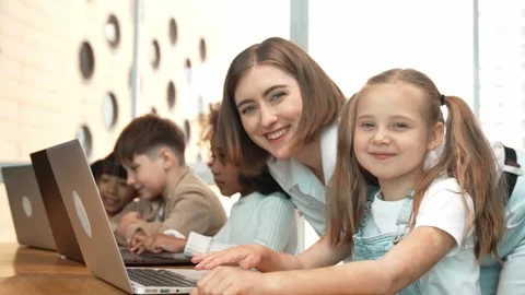 Student use laptop writing code while teacher explain about program. Erudition. Stock Footage 283404175