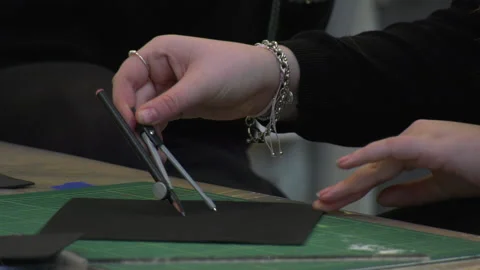 A student uses a compass to draw a circle 動画素材 239652630